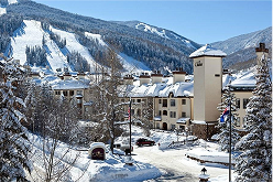 Beaver Creek ski resort scenery featuring snow-covered mountains, luxury accommodations, and a clear blue sky, highlighting the winter sports destination's appeal for ski rental services.